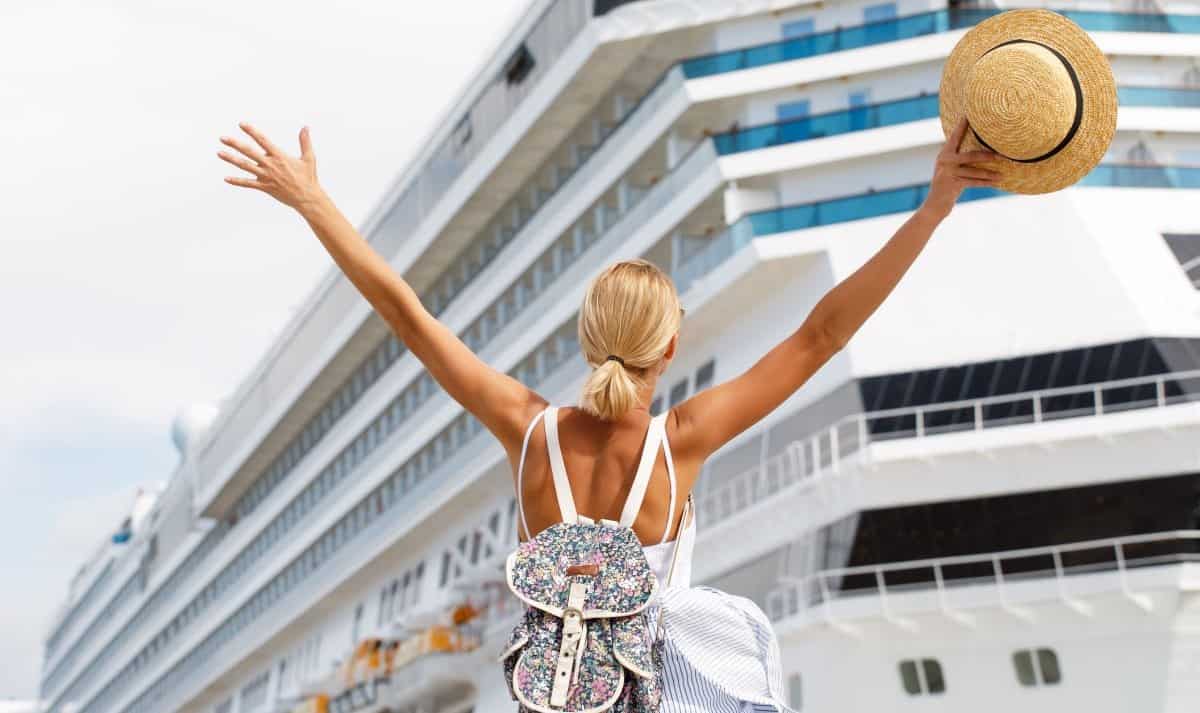 Woman in front of cruise ship