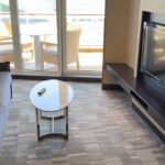 Norwegian Getaway Aft Facing Penthouse Suite - Living area and TV